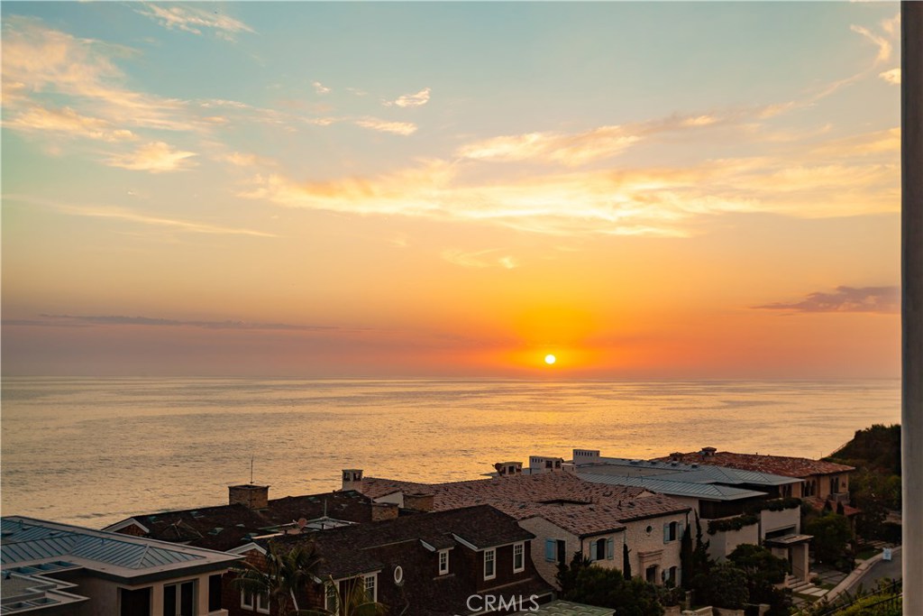 Surreal ocean views meld seamlessly with inspired architecture at this sumptuous coastal estate beyond the guarded gates of The Strand at Headlands in Dana Point's exclusive Monarch Beach enclave. Complementing authentic Mediterranean style with chic contemporary flair, the exemplary residence reflects the architectural design talents of CJ Light and the construction acumen of the Brown Brothers. Served by a private elevator, every level of the home opens to view-enriched decks and terraces via fold-away doors that welcome panoramic vistas from Dana Point southward across crashing waves, a sandy beach, Palos Verdes Peninsula on the northern horizon. Interior dimensions of approx. 8,999 s.f. allow ample room for formal and casual rooms, a theater, wine cellar, gym with sauna and massage room, 6 ensuite bedrooms and 7 full baths and 2 half baths. A chef-inspired kitchen showcases a massive island with seating, a breakfast room, butlers pantry, farmhouse sink, stone countertops, gorgeous cabinetry and high end appliances from Wolf, Bosch, Sub-Zero and Fisher & Paykel. Relax in a 5-star master suite with private ocean-view terrace, a fireplace, vaulted and beamed ceiling, dual oversized closets with furniture-caliber built-ins and dual baths with stand-alone tub and sit down vanity. Complete with patios and decks, include a fire pit, outdoor heaters, DSC Professional grill. The Strand is close to upscale shopping, dining and 5 Star Luxury Hotels and Resorts, recreation and more.