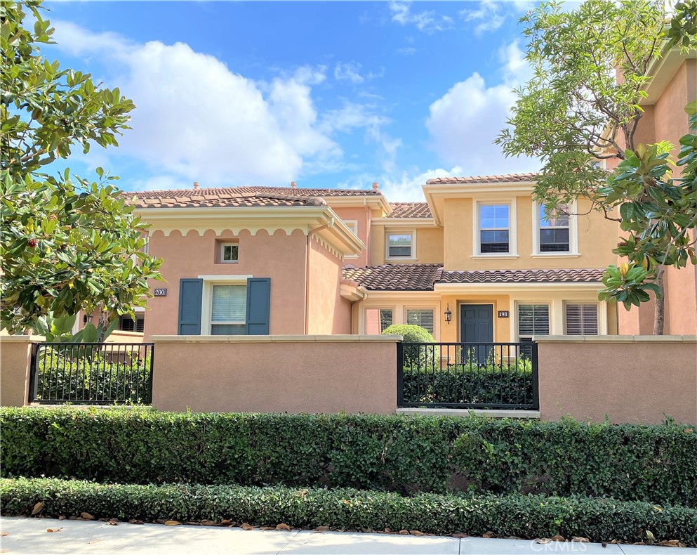 Resort Style Living at it's Finest! Beautiful condo in the community of Woodbury in the great city of Irvine. This award winning city of Irvine is #1 for 16 consecutive years as Safest City of it's size according to FBI data. #3 as Best city to Raise a Family and #4 Greenest city in America (according to Wallet Hub). Not to mention #12 as the Happiest Cities in America. With all this greatness in the city, who doesn't want to live in Irvine. Woodbury is a planned community in the city of Irvine with several large parks, tennis courts, beach volleyball, Basketball court, and a baseball and soccer field. Not to mention they have more than 5 Swimming pools you can access. Ralphs & Trader Joes, restaurants, Walgreens and Home depot is within a 5 min. Walk from your new home here in Woodbury community. This amazing 2 bedroom 2.5 bathroom condo has a cozy but open space concept, downstairs, with a lovely fireplace, making you feel at home the minute you walk in. The chef in the family will love the large Island Quartz counter top and easy access to the appliances to cook up a storm. Upstairs you will find 2 spacious En-Suite bedrooms with newer plush carpets, deep soaking tub in the master room, with dual sinks and walk in closet. To top it off, you also have a tandem 2 car attached garage with direct access to your new home. Come, relax at the park, ride a bike around the community or go for a swim in the Lagoon Pool. This is the Life Style you have been waiting for.