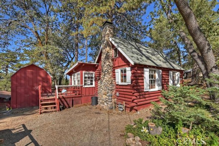 The mountains are calling & you must come! Come enjoy the crisp Autumn air from this quiet knoll in Arrowbear-just 5 miles from Snow Valley Ski Resort. This vintage charmer sits on 3 level lots offering great year round access & lots of parking including room for an RV. The main level features a large living room with beamed ceiling & rock fireplace, the dining room, open kitchen, bedroom 1, bath 1 with a shower & the master suite complete with a private bath. From this level there is access to the rear deck as well as the large storage shed with plenty of room for your tools & toys. Upstairs is the cozy attic bedroom offering extra sleeping space when needed! The vintage character coupled with the wonderful level lots will provide you with years of enjoyment along with the potential of additions, gardens & outdoor play space. Don't let this little treasure pass you by!