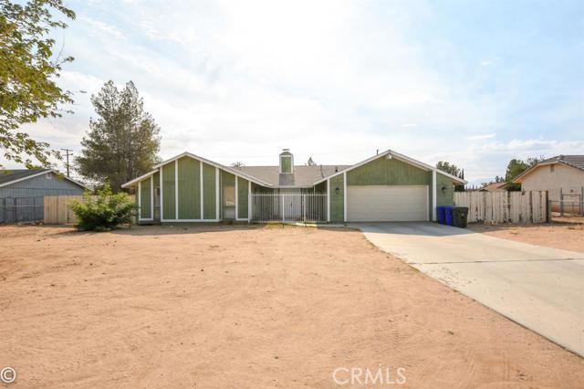 This cute home, situated in a quiet neighborhood in Apple Valley, has new tile flooring, new roof and a beautiful fireplace in the family room. With it's large backyard, it is just waiting for playtime and entertainment. It is close to schools, restaurants, movies and shopping. Association Amenities: None # of RV Spaces: 0NONE Lot Location Type: Standard Location Landscaping: Natural Special Features: Garage Door Opener # of Attached Spaces: 2 # of Detached Spaces: 0