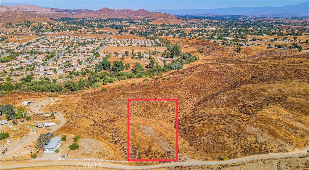 Perfect 3.88 Acres of gently rolling hills with useable pad .Conveniently located just outside of Canyon Lake and minutes from 15 or 215 Fwy.
Build your family compound or drop on a manufactured home with large shop. Possibilities are endless. Utilities are in the street.