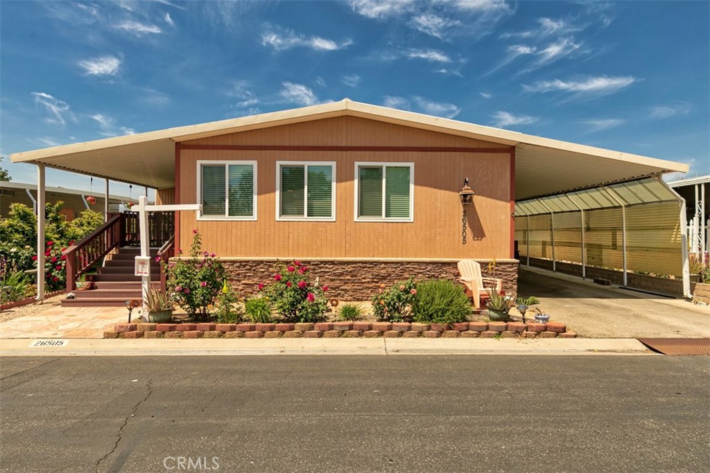 55+ Senior Community - Great curb appeal, 2 bedroom, 2 bath home with drywall throughout and all new dual pane windows! The sun room addition makes a great office or guest room and has been finished with beautiful hardwood flooring, drywall, A/C, heat and ceiling fan. Remodeled master bathroom features a custom walk-in/wheelchair accessible shower with dual sprayers and an elevated toilet. Enjoy a spacious kitchen with wood laminate flooring, lower cherry cabinets, a newer gas cook top and oven, roomy pantry and breakfast nook. Large family room with recessed lighting and ceiling fan. Backyard has great privacy with no neighbors behind, a newer Trex deck and planted with orange, apple and lemon trees. Located in a beautiful gated 55+ community, Greenbrier Estates features many amenities for residents including a clubhouse, 2 pools & spas, card room, billiard room, library and R.V. parking. Close to all shopping and dining. Welcome Home!