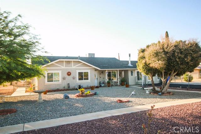 This is a lovely 3 bedroom 2 bath home in one of Apple Valleys quiet neighborhoods. This home is located near local grocery stores, excellent schools, and great views of the local mountain ranges. House is in great shape with desert landscaped yard and a nice detached garage, great place for a workshop. It also has a covered patio, its own laundry room and much more. Association Amenities: None # of RV Spaces: 0 Special Features: ,WKNONE Lot Location Type: Standard Location Special Features: Garage Door Opener # of Attached Spaces: 0 # of Detached Spaces: 2