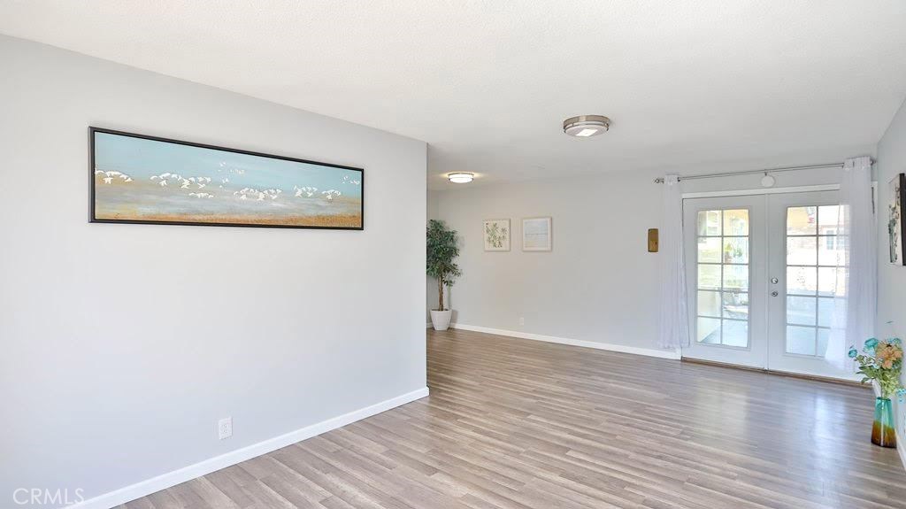BEAUTIFUL REMODELED !!! Private gate community only 12 units surrounding by all Single Family Residents, minutes to City of Tustin & Orange. This is the upper corner unit, just finished remodeling, new paint, new floor, new kitchen cabinets, stainless steel sink and appliances, Quartz counter tops, tile kitchen back flash. Double French door entrance to a large living room with window that brings natural daylight, bright and sight, dining area by the kitchen. Good size bedroom and large closet, Remodeled bathroom, tile walls shower over the bathtub, new vanity, new tile floor, new bathroom accessories. Quiet and well kept community with low HOA. Convenient location, this is a great opportunity for a first time home buyer, beautiful home at an affordable asking price, it's also an excellent investment with a high demand rental rate within this area, this is truly a home sweet home !