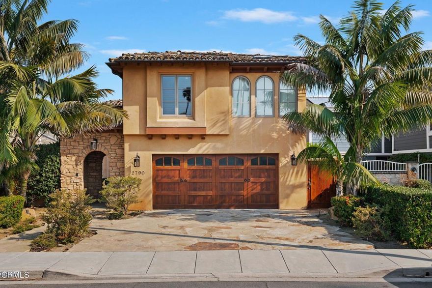 Waterfront boat dock home on 'Keys Island'! Beautiful Mediterranean Tuscan-style villa with an arch-stone gated portico opening to a private and serene courtyard. Enter the home through the custom wrought iron and glass double doors. Throughout the main level floors are brushed polished marble. Second level floors are distressed pecan hardwood. Each custom door, window frame and shelving throughout the home is Alder wood, hand finished and stained.  The warm, inviting living room features a rustic, hand-distressed wood-beamed ceiling with recessed lighting, a beautiful hand carved marble fireplace and a hidden temperature-controlled wine cellar. French doors with sidelights open to a waterfront retreat with a brushed marble entertainment deck and a 38 ft. boat dock.  The living room is open to the formal dining room which also opens to the waterfront deck. The dining room has a custom-made, built-in china cabinet with etched glass doors and mood lighting with dimmer. The kitchen features rainforest marble countertops, a spacious center prep island and custom cabinetry. Chef-quality  appliances include a Fisher & Paykel dishwasher, a Wolf convection oven and microwave, a wall faucet and pot-filler above the Wolf electric induction stove top, and a Sub-Zero refrigerator. Nearby there is a versatile room for a perfect study, office or media room. The spacious second level primary suite features a sitting room with a skylight, a hand-carved travertine fireplace,  built-in book shelves and entertainment center, and a wine refrigerator. The primary bedroom includes two walk-in closets, wood plantation shutters and a private 'Juliet' balcony overlooking the water. A spacious primary bathroom features a Roman-style soaking tub wrapped in hand-carved designer stone tiles, Kohler Zanzibar porcelain sinks, and marble countertops to complete the luxurious, spa-like experience. There is whole-house high-efficiency heating and air conditioning and an extra fine micro filter to preserve the clean air quality, and an energy recovery unit. Other amenities include a second-floor laundry room, and a sun/workout room with a skylight. The sound system is wired throughout both floors. The home has cement Redland Clay tile roofing, copper rain gutters, and is earthquake-engineered with steel plates. This Mediterranean masterpiece is beckoning to be you.