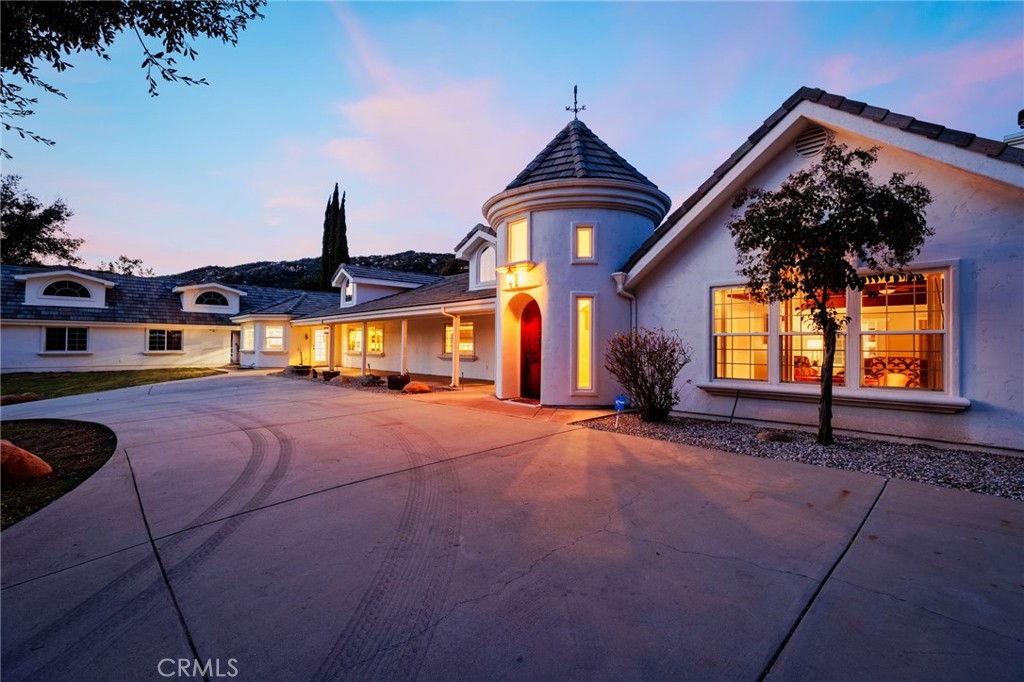 IMAGINE WHAT IT WOULD BE LIKE TO OWN THIS MAGICAL ESTATE RETREAT SURROUNDED BY OAK TREES LOCATED IN THE STUNNING COMMUNITY OF LA CRESTA. The property lies on 5 acres (approx). This estate home is also an Airbnb and is completely fenced. A creek also runs alongside the property at the bottom of the hill, adding to the dynamic and beautiful landscape of La Cresta. There is also an additional parcel included in the sales price. Both the home and vacant lot are approx. 5 acres each, for a total of 10 acres. This newly remodeled vacation home is a licensed Airbnb and has been in operation for over 1 year. Escape to this gorgeous Wine Country retreat for an unforgettable experience! The home has 5 bedrooms and 10 beds designed to accommodate up to 20 guests, making it the ideal place for large group getaways. The home features a game room with a pool table, four arcade cabinets, and a large flat-screen TV. For a more relaxed atmosphere, enjoy the oversized sofa in the living area or challenge your friends to a game of poker. The spacious kitchen is fully equipped for any meal you can imagine. Dine outdoors on the patio or cozy up inside for a meal with family and friends. The patio has a BBQ area for those that like to grill while taking in the breathtaking scenery around the property. The master suite has a King-sized bed, built-in trundle beds, and a luxurious bathroom with a stand-up shower and jetted tub. You'll find two guest bedrooms with bunk beds, each featuring a loft area. The rear bedroom serves as a cozy lounge area with a pull-out bed. Property has cross fencing and corrals. Bring your horses, dirt bikes, ATVs, and other outdoor toys to enjoy the wide-open space, as well as equestrian trails for horseback riding and hiking. Step outside and discover your own private haven in the backyard, featuring a stunning rock pool and spa with a waterfall and waterslide, perfect for hours of fun or relaxation. The backyard has a volleyball court and horseshoe pit for hours of family fun. The backyard has 3 firepits for evening gatherings. For convenience, the property includes a garage with space for up to six vehicles, making parking easy for everyone. Entire home is solar-powered. This property offers the perfect balance of fun and tranquility, while also providing a yearly income. Situated in close proximity to shopping, dining, and entertainment. This is a one-of-a-kind opportunity! It must be seen in person to be believed! Schedule your showing today!