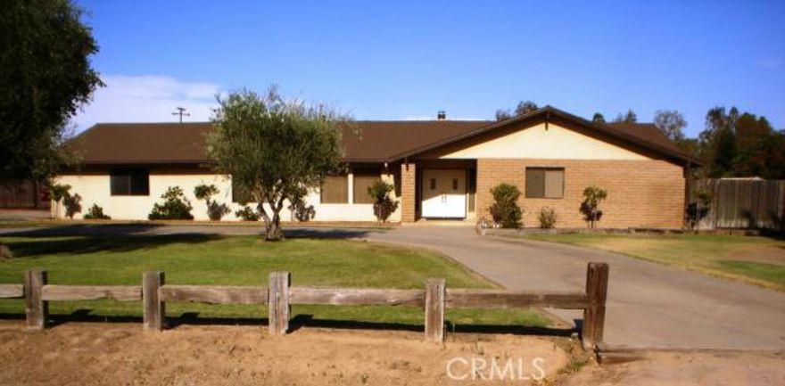 Lovely custom one owner home with shop on nice corner lot adjacent to vineyard in the Ranchos.  The home has been updated with granite counters, tile flooring, stainless steel appliances and crown molding.  Nice floor plan includes living room and family room, separate dining room open to kitchen and living room, sharp kitchen with lots of cabinetry, large master suite with separate vanity area, walk-in closet and oversize shower, utility room and lots of storage space throughout.  Home also includes large covered patio with ceiling fans and deep two car garage.  In addition, property features a 40' by 60' shop with electricity, roll up door and separate cement driveway.   Yard features fenced back yard with lots of grass, trees and walkway to back area that provides fruit trees and a garden area.   Home is situated on a nice corner lot across from peaceful vineyard with quick access into north Fresno.