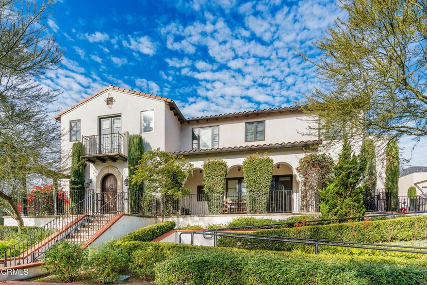 Impeccably designed, this sophisticated, contemporary Spanish townhome provides an expansive, open feel throughout, offering high ceilings, gorgeous architectural detail, and tremendous privacy, all within a couple blocks of beloved Sierra Madre's downtown. A noticeable quiet descends upon this rear unit, creating a sanctuary of elegance as you enter the expansive living and dining room with beamed ceilings, beautiful French doors opening to an arched breezeway for seamless indoor-outdoor living. The living space, which includes a temperature-controlled wine room and separate powder room, flows into the kitchen, complete with custom cabinetry integrated into the fridge and new dishwasher (replaced 2023), a welcoming peninsula to gather around, and a full size pantry, all with direct access to the garage. Venture upstairs to a bright, light-filled landing, adjacent to three full bedroom suites, the primary suite including a large closet with built-ins, French doors opening to a large balcony, and a bathroom with an ''Airbath'' soaking tub with tree-top views for privacy, double sink vanity, and separate shower with glass enclosure.  The other two bedroom suites, one of which has a private balcony, each have ample closet space, plenty of light, and a 3/4 bathroom. Along with energy efficient dual pane windows, Nest thermostat, tankless water heater, and LED lighting, the home also includes a new HVAC system (replaced 2023), central vacuum, secured driveway gate with remote access, guest parking space within the complex, sound and security systems with fire sprinklers. This is a rare opportunity to live in a unique, newer-built community that offers privacy, spacious comfort, and easy access to Sierra Madre's very special and cherished foothill village and hiking trails.