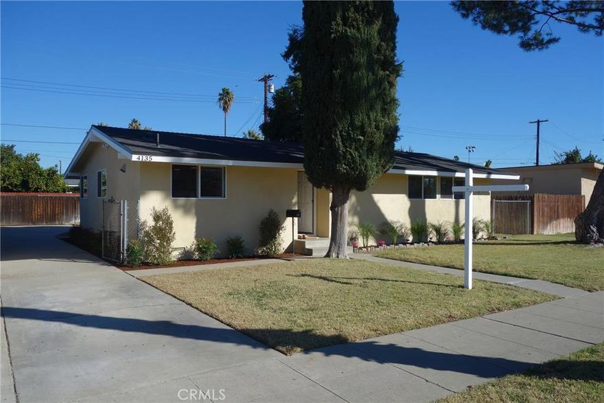 Beautifully remodeled home on tree lined street. Great interior tract on a cul-de-sac, located next to a park. The lot has RV access and parking. The home offers an open concept floor plan with soaring ceilings, 4 bedrooms and 2 bathrooms. All bedrooms are good sized with vaulted ceilings. The kitchen is spacious with an island, new lighting, stainless steel appliances and brand new quartz counter tops. The living room has a cozy fireplace and double door access to the backyard. Additional features of the home include fresh interior/exterior paint, new dual pane windows, new interior/exterior doors, new closet doors, new hardware, new lighting, new fixtures, new baseboard, new carpet and new wood laminate flooring. The bathrooms have matching quartz counter tops, new toilets, new cabinets, new sinks, new fixtures and beautiful ceramic tile. There is a 2 car detached garage with laundry hook ups and storage space.