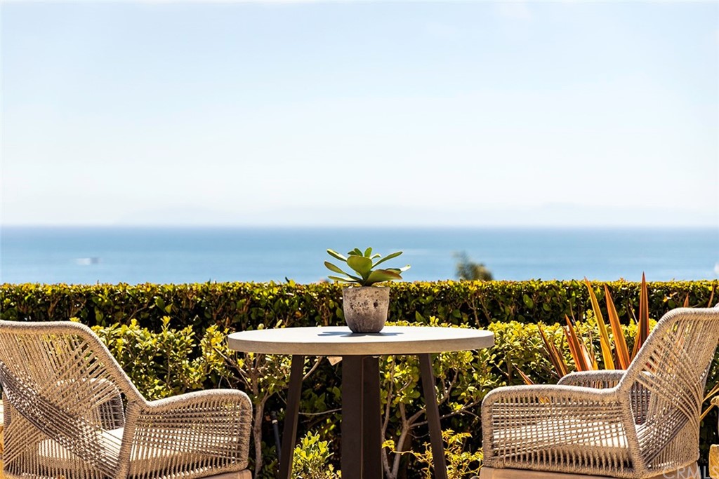 A contemporary Mediterranean seaside villa with main level master suite is the dream of coastal living coming true. This newly renovated turnkey home offers 180 degree panoramic views of Pacific Ocean, Catalina Island, Newport Harbor, sunsets & city lights up the coast. Lives like a single level with all the main entertaining areas on the first level including a great room with soaring ceiling, a gourmet kitchen, dining room, the master suite, a guest suite, and an office. Upper level offers 2 bedroom suites and a bonus/exercise room. 3-car garage with built-ins. This model perfect home has been transformed featuring a newly designed kitchen with Taj Mahal quartzite countertops, backsplashes, waterfall center island, 2 wine cellers (one temperature controlled). The master bathroom features freestanding tub, quartzite countertops, backsplashes, tub surround, & vanity. Set against the stunning ocean vista, the lushly landscaped grounds offer a salt water pool, spa with fire bowls, fountain, 2 outdoor fireplaces, a firepit, gazebo, BBQ. Perfect setting for entertaining and Southern California living.