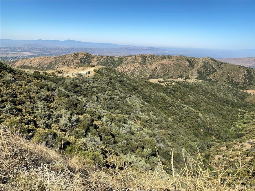 4.83 peaceful acres in San Bernardino County, elevation 4100ft with 270-degree endless sunset views. Community well with 7000-gallon buffer tank and fire hydrant riser. 15 minutes from Stater Bros, Zoned for SFR, Ideal for off-grid living in the Yucaipa Valley American Viticultural Area.