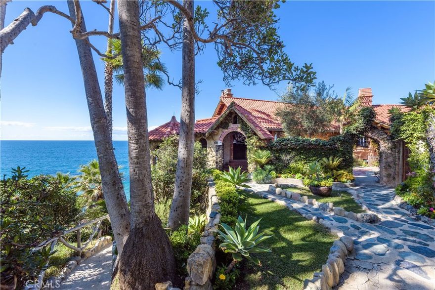 It is an incredibly rare moment when history, beauty, opulence and an oceanfront setting come together at one time, presenting an opportunity that is truly provocative. Crowning a dramatic bluff between Moss Point and Victoria Beach in Laguna Beach, Villa Rockledge encompasses nearly 25,000 square feet of seaside splendor, complete with stairs leading to a private cove. Created nearly 100 years ago, the tranquil oasis reveals panoramic ocean, whitewater and sunset views, exquisitely landscaped grounds, a main house and 4 guest villas. Enjoy 12 bedrooms, 11 baths, and gated parking for 12-plus cars. Exquisite attention to detail is evident in stained-glass windows, a cigar loft, carved wood doors, wrought iron accents, stone fireplaces, window seats, hardwood floors and crystal chandeliers. Listed on the National Register of Historic Places and showcased in a book about its creation and history, Villa Rockledge is Mills Act-approved, offering a significant tax break for maintaining the custom estate&#8217;s appearance. While retaining its classic Mediterranean-inspired style, the property is professionally restored and upgraded with today&#8217;s preferred appointments. Also known as Mariona Villa, the estate has a rich history enhanced by the allure of Old Hollywood. Actress Bette Davis met her third husband here in the mid-1940s, and Actor Erroll Flynn was known to visit. An enviable location is moments from restaurants, shops, galleries and resorts.