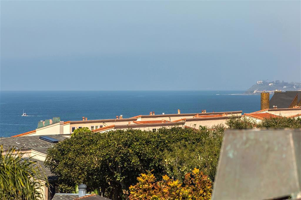 Relax and enjoy panoramic ocean views, majestic sunsets, ocean breezes and the sound of waves, just above the Pacific Ocean. Tropical landscaping, koi ponds, an ocean front path along the length of the complex with a secluded sandy beach below which can be reached by descending the public steps next to the complex. A lovely pool, spa, 2 tennis courts, a clubhouse, lagoon, and sauna provide resort living right out your front door. Beautifully remodeled with many upgrades. Live everyday like a vacation day! Neighborhoods: Bluff Equipment: Dryer, Range/Oven, Washer Other Fees: 0 Sewer: Sewer Available Topography: GSL