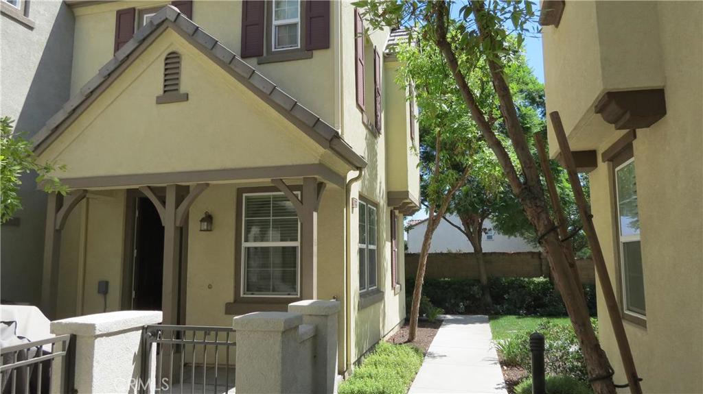 Newer Built Townhouse with 2 story design. The home has 3 bedrooms and 21/2 bathrooms. Tile flooring with Corian Counter top in the Kitchen awaits the cook in the family. Laminate flooring downstairs and upstairs for easy maintenance. Both bathrooms have tile flooring and the Master Bathroom has double sinks, soaking tub and shower with a walk in closet. There is even a built in computer or tech area for you kids to do their homework. 2 Car garage with direct access to the home. Cute front porch for relaxing and the community has Association Pool and BBQ area and a Clubhouse for you to enjoy. The home is close to shopping center, market, bank, parks and easy access to the 60, 71 & 91 Freeway. Small Pets are ok with additional deposit.