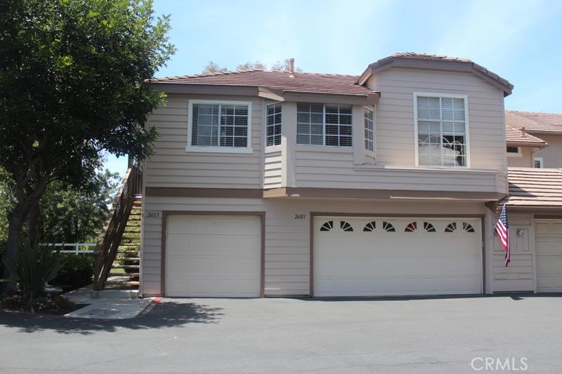 Beautiful and Private End Unit with a one car garage just below you. This Carriage Unit has no one living above or below you adding to privacy.
Private patio looks on to greenbelt and views. Home is Light & Bright. Laminate Flooring throughout,indoor laundry with washer/dryer included, refrigerator is also included. Freshly painted with custom color and white baseboards. Wooden window blinds throughout. Community includes an Association pool and spa. Must see home!
