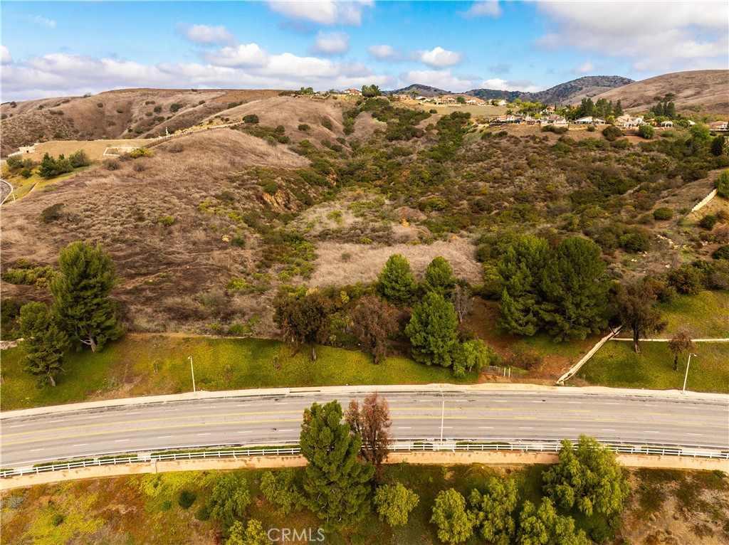 Discover 4225 Fairmont Blvd, a 23.14 acre property ideally situated in a residential neighborhood in Yorba Linda, an upscale community renowned for top-rated schools (Placentia-Yorba Linda Unified), beautiful parks, and abundant local amenities. This site naturally integrates with surrounding neighborhoods of well-maintained single-family homes, offering convenient access to major thoroughfares, retail centers, dining options, and local landmarks such as the Richard Nixon Presidential Library and Black Gold Golf Club.
A significant portion of the property carries a Medium Residential (RS) designation, with initial city feedback allowing 30 units to be developed. With recently passed Measure JJ in place, developers benefit from a streamlined entitlement process through an amendment to the PD plan, making 4225 Fairmont an outstanding opportunity to create a thoughtfully planned residential community in one of Orange County’s most desirable locales, so no General Plan Amendment is required to develop residential onsite.
Whether you envision a single-family subdivision or another residential concept, this property’s scale and flexible zoning offer extensive possibilities. Interested parties are encouraged to verify all zoning and development details with the City of Yorba Linda.
APN 326-081-01