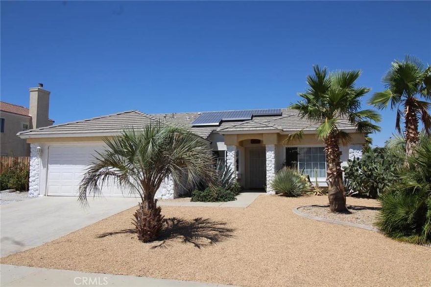 This is an Oasis in the Desert. Majestic palms, an in-ground pool & spa and a Casita or guest house all make this a slice of paradise.  This home is a 3 bedroom, 2 bath home plus it has separate one bedroom one bath casita.  Features include an enclosed patio with slate floors for the extra game room or kids play room, an up graded Island kitchen with granite, newer maple cabinets & stainless steel appliances.  There is indoor laundry, a walk in closet in the master suite & efficient solar power.  A lot of improvements were done in the last 5-6 years. Take a look today!