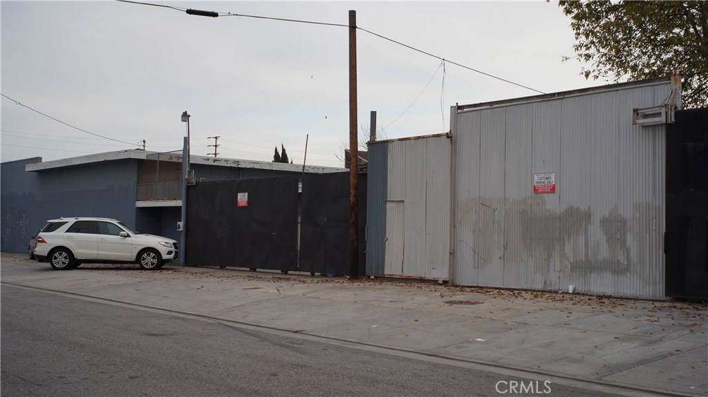 Fantastic property with many uses potential. Great location. This property has over 160 feet on the Salt Lake Avenue, a lot of exposure. This property also has 155 feet frontage on Olive Street. Zone M2. There are three parcels together. There are two warehouse buildings both with 14 feet ceiling heights. Building 1 is 58 ft X 36 ft. Building 2 is 72 ft X 62 ft. Both have attached office spaces. Office 1: 10ft X 38 ft; office 2: 24ft X 17ft Very large fenced yard. This property has a lot of upside potential. It is very versatile. Office in front to Olive Street. Do not contact occupant and do not go without appointment. Security system. There are three parcels together.