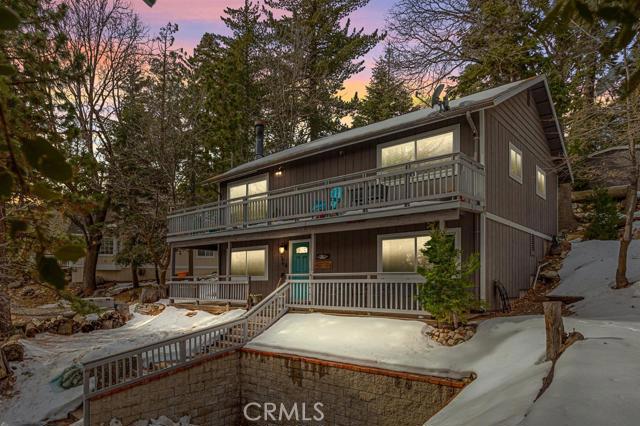 Twin Peaks cabin is beautifully decorated and will come furnished!. Concrete driveway with Level parking for 2 cars in front. This home features 3 bedrooms, 2 baths and two living room areas. New Dual Pane windows, Indoor Laundry and ample storage in build up. There is an outside 10x8 shed for tools and bikes, and your snow items or toys. Enjoy your outdoors with a patio deck and tree views. Large lot with RV parking or for recreational use. Trex decking wraps around both levels. Updated Kitchen with Granite counters, a great space to hangout. Wonderful Mountain home waiting for its next owners.