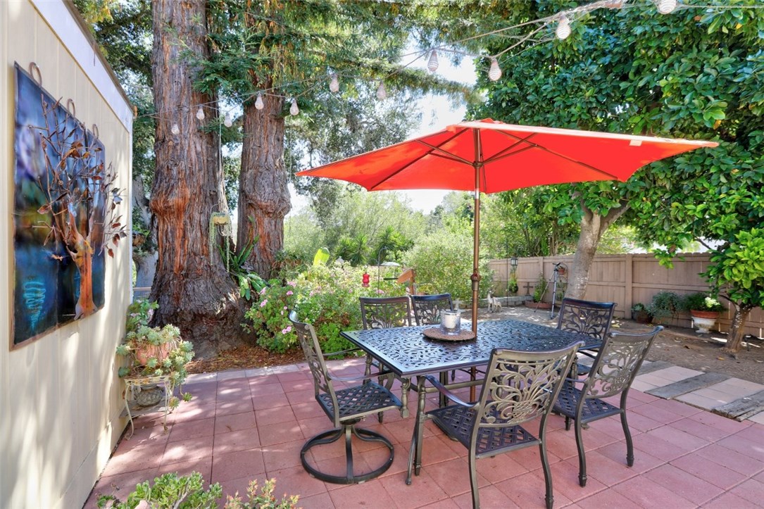 Creekside Cottage!! Lovely 3 bedroom home with flagstone patios nestled under mature trees overlooking the Arroyo Grande Creek conveniently
located within walking distance of the charming Village of Arroyo Grande. Bolsa Chica Mobile Estates is a resident owned senior community with NO SPACE RENT and low HOA fees. As you approach the front door, you are greeted by a darling front porch with room for all your plants plus plenty of comfy chairs to enjoy the evening sunsets. Upon entering this beautiful 2010 built home you will find everything you need including a cozy fireplace, large kitchen with plenty of storage, formal dining area, and inside laundry room. The generous covered carport easily accommodates plenty of parking for you and your guests. With a large storage shed there is ample room for all those gardening tools and outdoor equipment. Peaceful views of lush foliage along the creek banks provide a spectacular spot for enjoying family and friends for morning coffee and evening barbecues. This home is bursting with personality, one of a kind beauty and is a must see! Call your favorite agent before this one gets away!