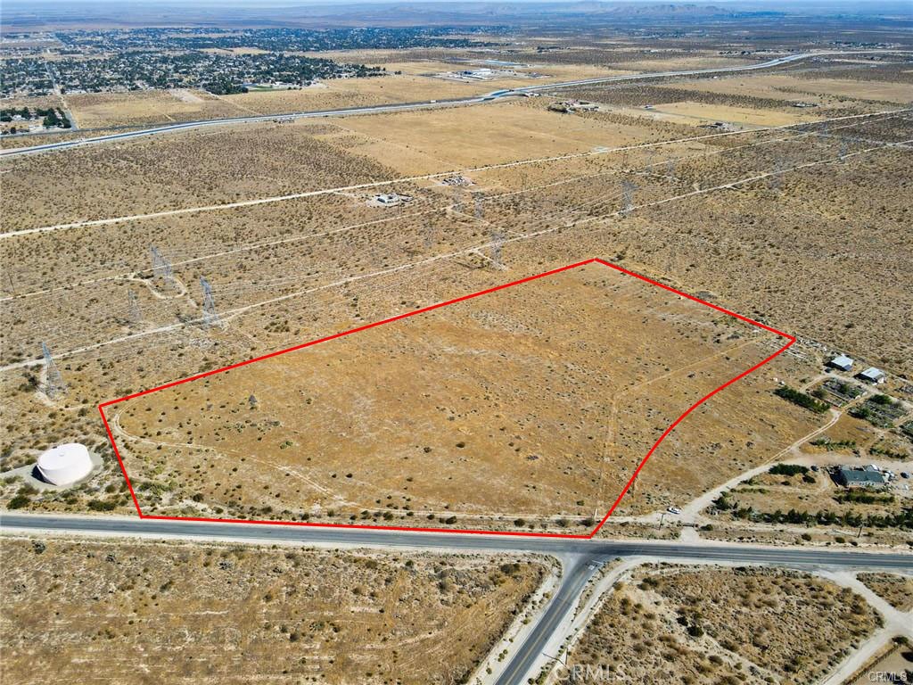 Location! This property is located at the intersection of paved Emma Rd, with one entire side facing Fort Tejon, a fully paved road. Additionally, Fort Tejon Rd connects to the paved 87th St. just 1,000 feet away. With such an ideal location, combined with the fact that 40 WATER PIPES UNDEGROUND are already installed, this is an incredible opportunity.