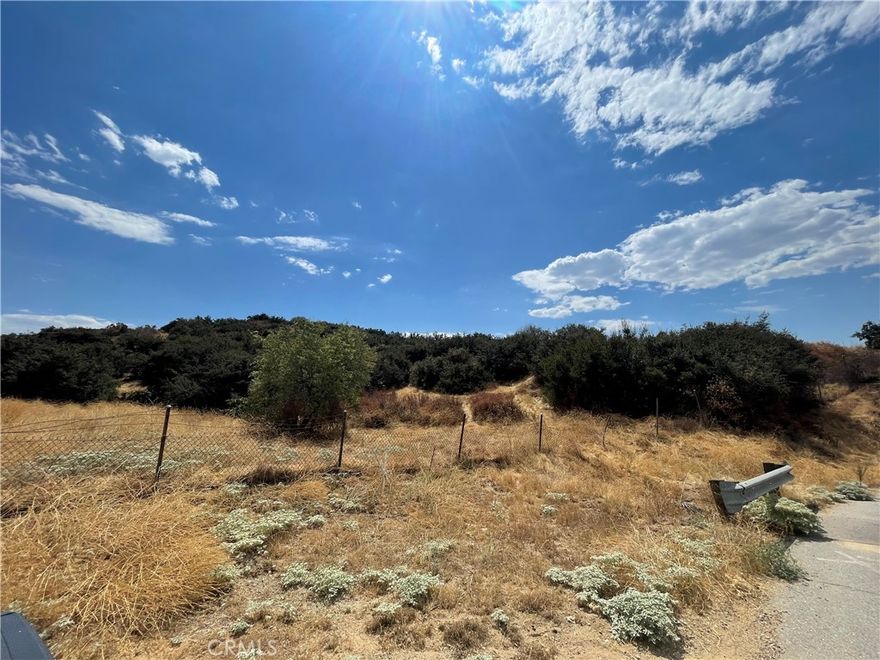 Perched in the heart of Yucaipa’s sought-after North Bench, this expansive parcel offers unrivaled panoramic views of the San Bernardino Mountains, twinkling city lights, and serene valleys below. Perfectly poised for a custom luxury estate, this gently sloping lot provides the ideal canvas for a 7,500 sq ft masterpiece, complete with room for sprawling outdoor living spaces, a pool, or lush gardens. Embrace the tranquility of rural charm while staying just minutes from Yucaipa’s vibrant downtown and easy I-10 access to Riverside or Los Angeles.