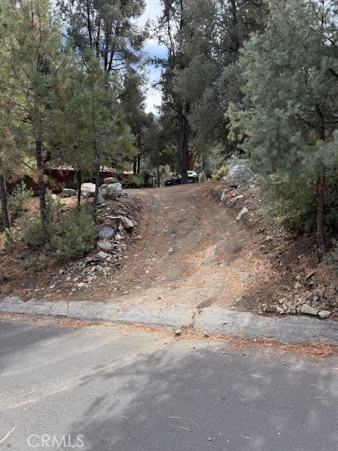 Are you looking for a very buildable mostly flat lot. Plenty of room to build a home of your liking. Plenty of trees in a very quiet neighborhood. Drive-by and check it out. This will sell fast at this price. Views of the north side of Mt Pinos. Come up and enjoy our 4 seasons