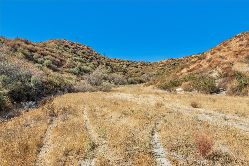 Discover this incredible opportunity to own 3 acres of pristine land in the highly sought-after Sand Canyon area. This prime residential lot boasts breathtaking views and offers the perfect setting to build your dream home! A graded dirt road leads you to this private, two level parcel, making access simple and convenient.
Enjoy a serene and exclusive lifestyle while being just down the road from the renowned Sand Canyon Country Club, hotel, and resort. This exceptional location provides both tranquility and proximity to luxury amenities.
Don’t miss out on this rare opportunity to own a stunning piece of land in one of the most desirable neighborhoods. The property is ready for you to create your custom estate or an elegant retreat.