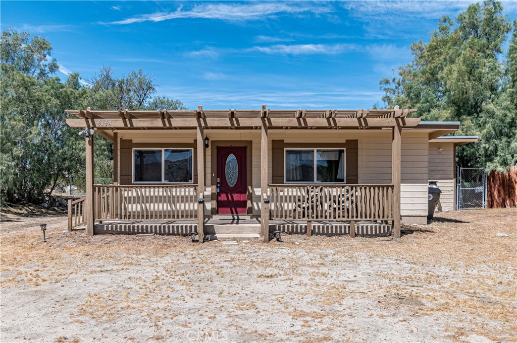 1950's home updated in 2013. Located on a quiet street with mountain views. Horse Property , have your chickens and any other animals , plenty of property space! Loads of character from the huge front porch to the beams in main living area. Master bath with Jacuzzi brand tub with shower head. tile in tub/shower areas in both bathrooms. Kitchen features granite countertops and stainless steel appliances. A large area that is approximately 1/2 of the backyard area is fenced in for children and pet safety. There is a gas furnace and a wood burning fireplace for heat. new mini split AC New roof in December 2018. Large Tamarisk trees line the property 2 Bedroom 2 Bath, has a bonus room with a closet that can be used as a 3rd. bedroom or office. Beautiful laminate flooring in front living room, carpet in the family room. All amenities with in 3 miles, so have best of both worlds, lots of privacy on a secluded road but still close enough to all your amenities for convivence. Close to Joshua Tree, lots' of outdoor activities, great hikes, beautiful view of the mountains right from your front porch! Attached shed for extra storage. 2 of the Bedrooms have attached bathroom. Living Room and a Great Family Room with Open concept! Also a huge laundry/storage room. It may look small from the road but this house goes on and on when inside. All of this on a 27,225 square foot lot! Lots of potential. Property is on Septic, looking at the arial pictures, the property extends past the backyard fencing, which is only the half way mark of the total property sq. footage