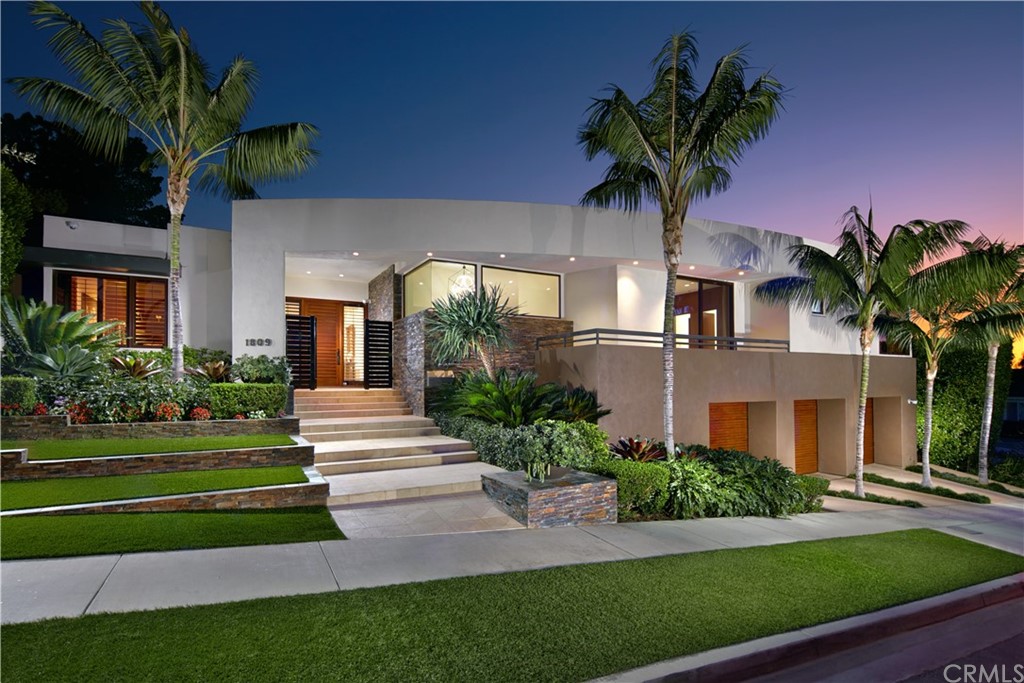 Contemporary and exuberant, this bay-view masterpiece nestled in Irvine Terrace offers drama at every turn. The sun-drenched four-bedroom residence is accoutered with luxury lifestyle amenities including an elevator, sauna, Control4 home automation, and glass pocket sliding doors. Set on a lot in excess of 10,500 square feet, the elegant outdoor spaces are composed of verdant, perfectly landscaped patios, Lynx outdoor kitchen, saltwater pool, spa, and outdoor dining areas warmed by a gas fireplace. Vast walls of Fleetwood doors and windows blur the lines between indoors and outdoors and fill the grandly proportioned living spaces with an abundance of natural light. Among the decorative flourishes are wood flooring, custom built-ins, and bespoke fireplaces curating the idyllic setting for recreation and entertaining. Akin to the finest neighboring resorts, the master bedroom is anchored by a fireplace and offers a substantial walk-in closet, soaking tub, oversized walk-in shower, large vanity area, separate vanity sinks, and opens onto the property's private and serene grounds by way of glass sliding doors. An office/optional fifth bedroom, formal dining room with a balcony, laundry room, and two commodious en-suite guest bedrooms set behind flush doors round out the main level. Descending one level, there is a media room, bonus room with sliding doors that lead to the backyard, a full bathroom, and direct access to the three-car garage. 50 seller-owned solar panels, a Miele coffee maker, Subzero and Wolf appliances, Water Techniques water filteration system, and security cameras are further delights. A rare confluence of grandeur, functionality, and location is found at 1809 Seadrift Dr.