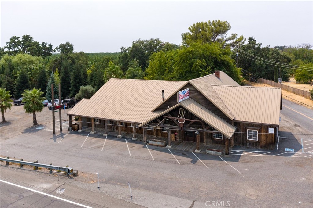 The iconic Lassen Steakhouse restaurant building situated on 2.3 acres is for sale. The sale includes the real estate, all existing restaurant and venue equipment, including an ABC Type 47 Liquor License. The restaurant, kitchen and bar were extensively remodeled last year with over $170,000 in improvements. Located directly on Highway 99, The Lassen Steakhouse has been at this location since 1928 and has been a local favorite for patrons traveling along Highway 99 and surrounding towns in Northern California. The interior ambience is amazing! With the rough-sawn open beam rafters, esthetically pleasing stone walls, banquet room, beautifully appointed full bar, fireplace and belt driven ceiling fans provides a great dining ambience. The restaurant portion can accommodate up to 140 patrons. Owner can transfer business name and continue The Lassen Steak House legacy or start your own restaurant and venues in this turn-key establishment. Located 1 mile from the New Clairvaux winery and monastery which provides a huge draw for wine lovers and history buffs alike. In order to access the winery you must pass by the subject property which is located on the corner of Vina road and Highway 99. Attracting guests of New Clairvaux is a wonderful opportunity, as monastery rules will not allow an onsite restaurant or hold events past 5:00 pm, making the Lassen Steakhouse and venue the best choice lunch or dinner stop, as it is the only restaurant in the area. Outdoors you will find 2.3 acres of beautiful landscaped grounds that have been used for wedding venues, parties, proms, etc. The pavilion, outdoor bar, meandering creek and enough tables and chairs for up to 200 guests, make this the ideal location for a turn-key venue. The AG-2 zoning allows for the construction of an additional dwelling. A new well was installed in 2020. The existing note of $385,000 is assumable. The property is conveniently located between Chico, Red Bluff and Corning. Everything is in place for you to start a successful business today!