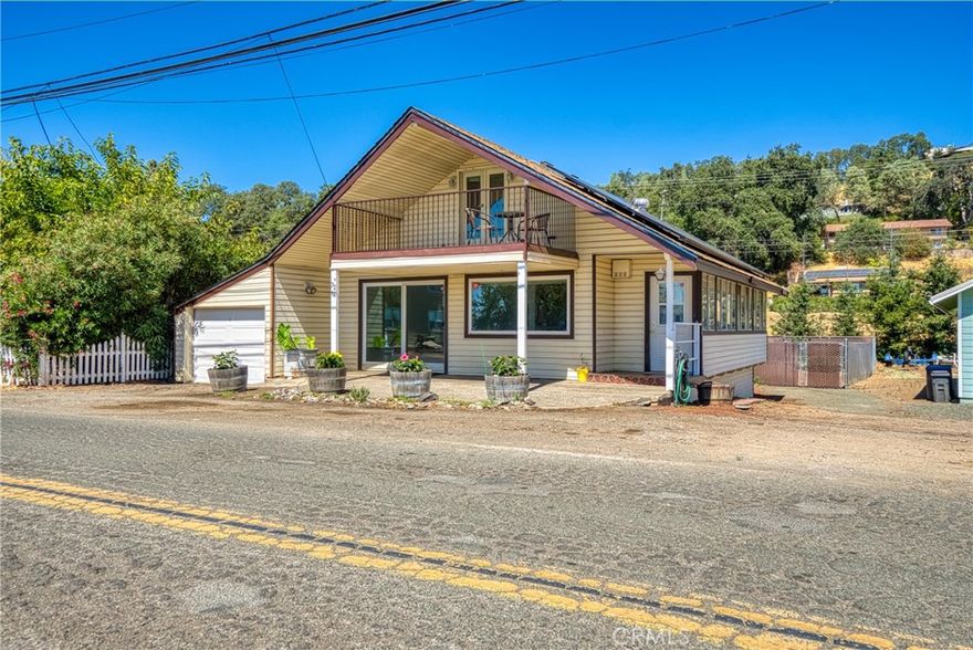 ATTN: Fisherman! This is the perfect property for getting away to Clear Lake. This 2 bedroom 2 bath home in Nice includes a lake front lot across the street that includes a wonderful patio, rose garden, pier, swim platform, and boat whips to tie up your boat. Home has 2 garages: 1-car garage in front and a 2-car garage in back.  Plenty of room to park you boat, trailers, and RV's in the large fenced backyard. New roof just installed, new appliances in kitchen, new HVAC, new carpet, new interior paint. Upstairs room has bathroom, wood burning stove and patio with a view of the lake. What a great place to sit read and book, have your morning coffee and enjoy the view of Clear Lake. Sunroom off the kitchen for added room. Home has leased solar to help with the electric bills. Close to stores, restaurants, parks and boat launch.