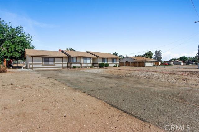AFFORDABLE HESPERIA HOME! Three bedrooms and two baths. Converted garage has three extra rooms. Living room with cozy fireplace. Updated kitchen with granite and new appliances. New exterior and interior paint, carpet, flooring, blinds and lighting. Indoor laundry. Granite counter and new sink in master bath. Covered patio. Large fenced lot. Centrally located. Show and sell!!! Association Amenities: None # of RV Spaces: 0NONE Lot Location Type: Standard Location Landscaping: Natural Special Features: Cable TV # of Attached Spaces: 0 # of Detached Spaces: 0