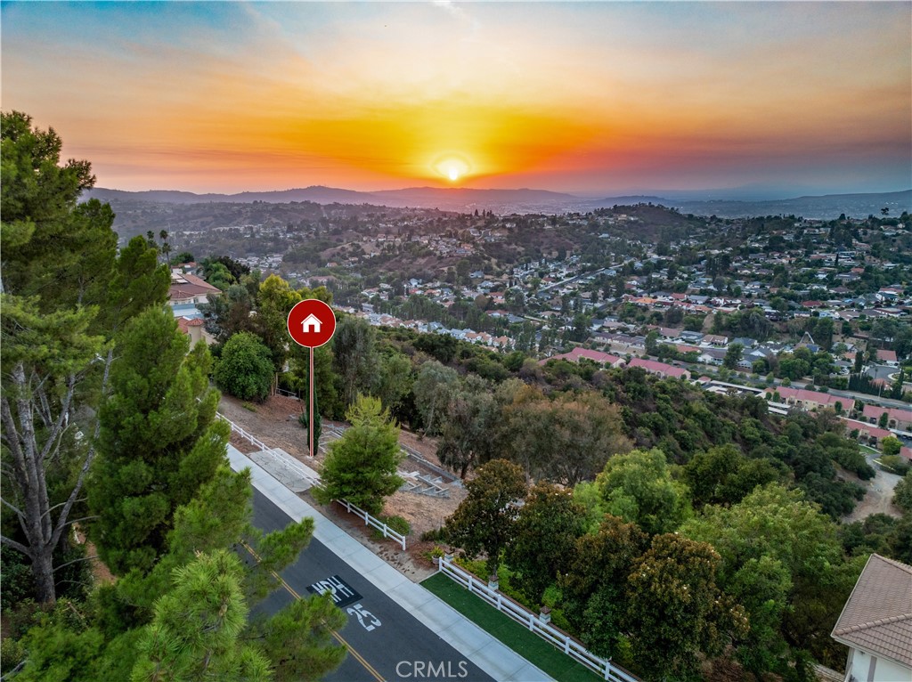 Discover this remarkable panoramic view lot located within the prestigious 24-hour guard-gated community of 'The Country.' Boasting an expansive 141-foot frontage (per title), this prime piece of land is surrounded by luxurious multi-million-dollar estates. The seller has already completed a geo report and sewer map, providing peace of mind as you plan to build your dream custom mansion. Residents enjoy access to exclusive amenities, including a community pool, tennis courts, and clubhouse. Owner financing available with 50% down payment for a short-term carry