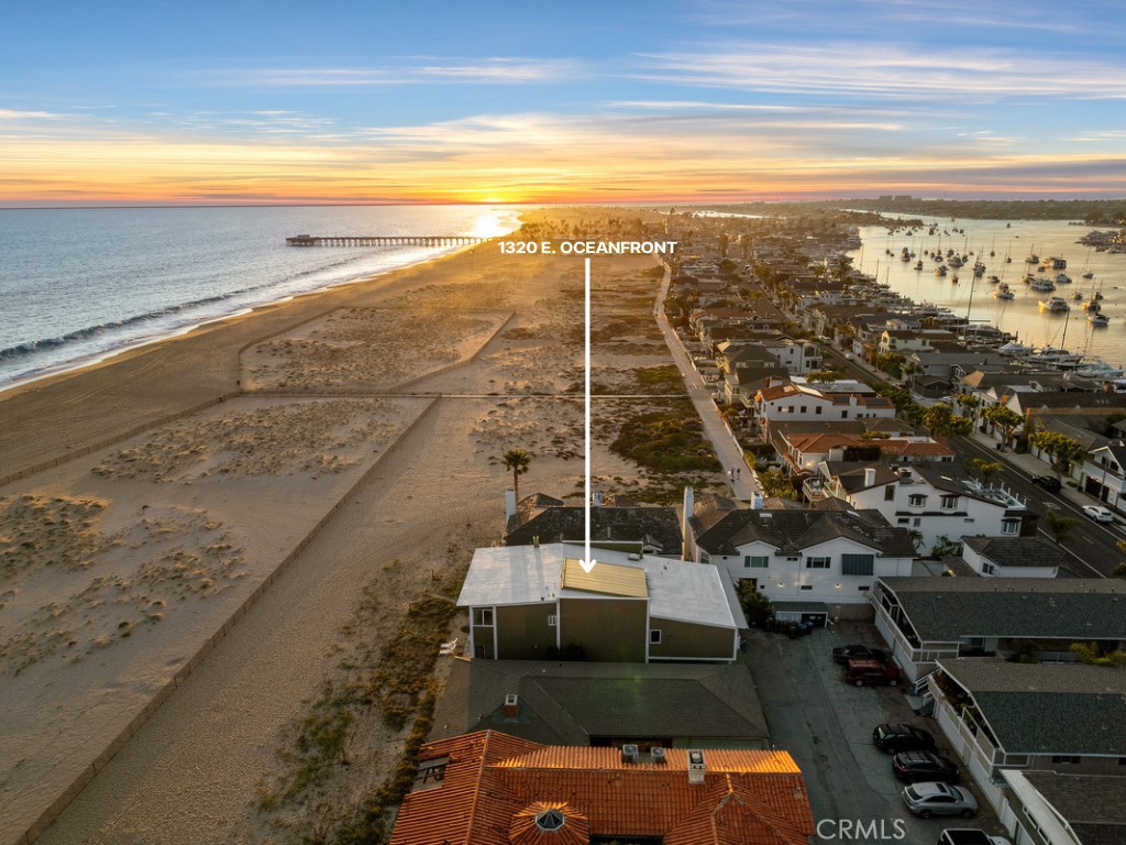 Located directly on the oceanfront sand of Newport Beach’s desirable Balboa Peninsula, beyond where the boardwalk and bike path ends, and Peninsula Point begins, this Mid-Century Modern showplace remains virtually original since its completion in 1960. Panoramic Pacific Ocean and beach views are enjoyed from the custom home, which also offers views of the Balboa Pier and Lifeguard Tower G. With approximately 45' of beach frontage and a homesite of nearly 4,609 square feet, the property is ideal for those who wish to own an architecturally unique residence, restore it while incorporating modern tech and amenities, OR build an entirely new dream home. First impressions are grand at the five-bedroom, four-bath home, thanks to a stunning double-height atrium-style entry with an in-ground pool/spa, vaulted ceiling, large skylight, cork walls, and a floating staircase leading to loft areas above. The kitchen and family room are united in one ocean-view space complete with large windows, illuminated ceiling beams, granite countertops, a breakfast nook and abundant cabinetry. The versatile home is exceptionally open and bright, and it offers the unique opportunity to live on a prime location - Oceanfront. Ample stretches of sandy beaches, Balboa Island, the Balboa Fun Zone, golf, high-end shopping and dining, and award-winning schools are all close by. Trust Sale.