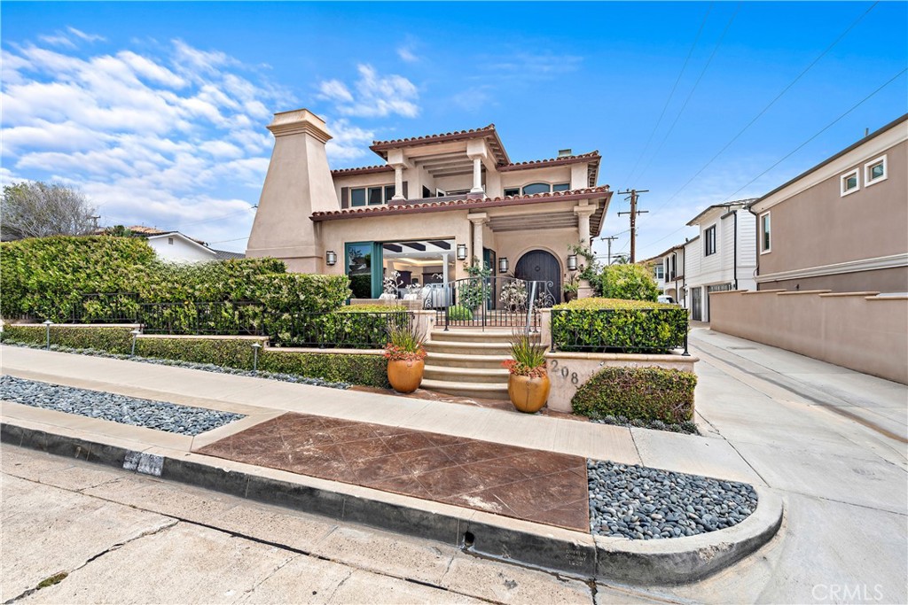 This stunning coastal estate is situated on a large, 45-foot wide lot on the 200 block