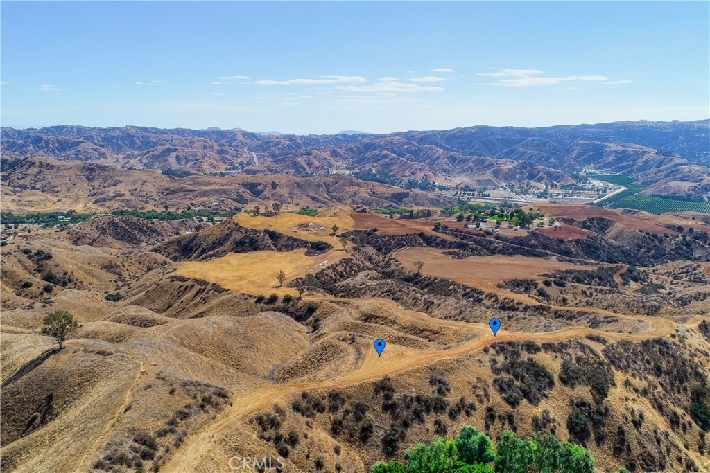 Build your dream home in the esteemed hills of South Redlands. Two attached parcels at 2.5 acres apiece. Gorgeous panoramic views of the soaring canyon. Biking, hiking, horse trails, parks, golf at the pristine Redlands Country Club, and lovely Downtown shopping. Ready for utilities!