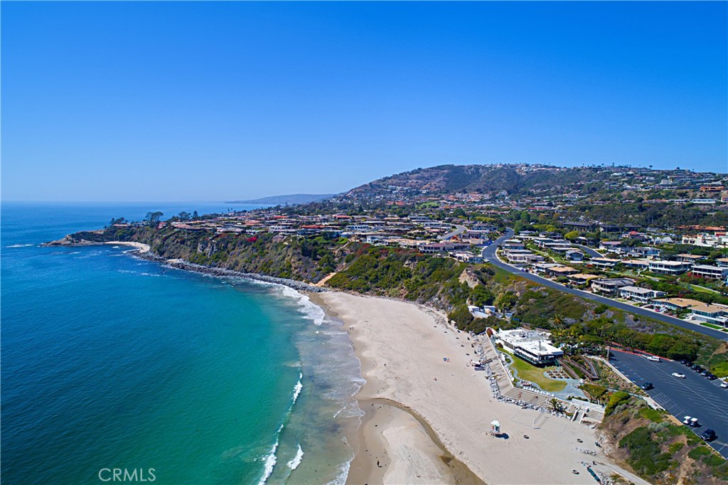 If you’re searching for the perfect beach house and the most prestigious 24-hour guard-gated neighborhood with its own private beach club on the sand in coastal Orange County, your dream has come true! Minutes away from 5-star resorts including the Montage, Ritz Carlton and Waldorf Astoria. Monarch Beach is known world-wide as the resort area of Dana Point and is renowned for its walkability and numerous amenities including pristine beaches, fine dining, golf, tennis, hiking and the Dana Point Harbor. The Monarch Bay Private Beach Club is very rare and unique to California and the only one on the ocean in Orange County. This single-level home is situated on a private 12,580 square foot lot with a sizable pool.