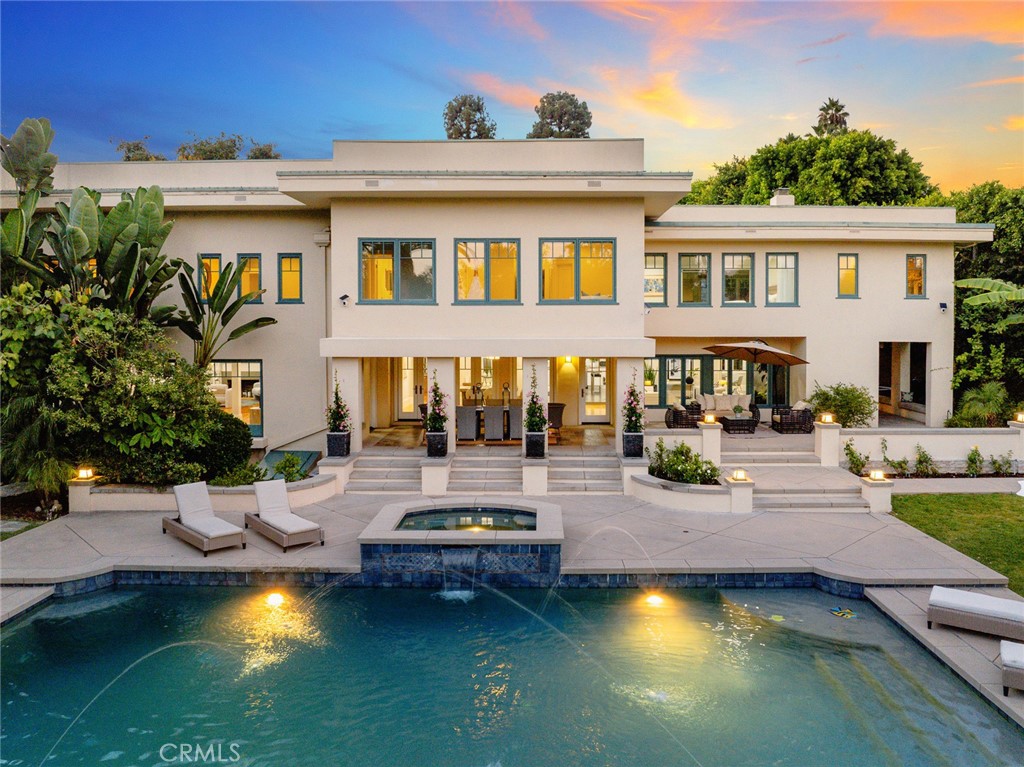 Lovely Pasadena Estate! If casual elegance is what you’re looking for in a home, then look no further than this lovely estate! Located in the prestigious Langham Huntington Hotel District, this impressive property features a stunning 7-Bed/8-Bath main house (5,669SF), and charming 2-Bed/2-Bath Guest House (962SF). The expansive outdoors includes a large, covered loggia, inviting pool and spa, BBQ area, and outdoor shower. All of this is tucked into a private half-acre of well-manicured gardens and lawn.
The home is loaded with upgrades including a sleek gourmet kitchen, equipped with Miele appliances. Did someone say Expresso machine? A wide, Craftsman inspired staircase leads to the upstairs and 6 of the 7 bedrooms including the primary suite, where a steam shower and sitting area are sure to help unwind after a long day. There is also a finished basement (559SF) ready to be used as a game room or converted to whatever your heart’s desire. The garage is 698 SF (T) and includes a half-bath.
Throughout the home, dual pane windows let in an abundance of natural light. Additionally, there are 3 sets of French doors that open from the formal dining room to the loggia. Perfect for entertaining.