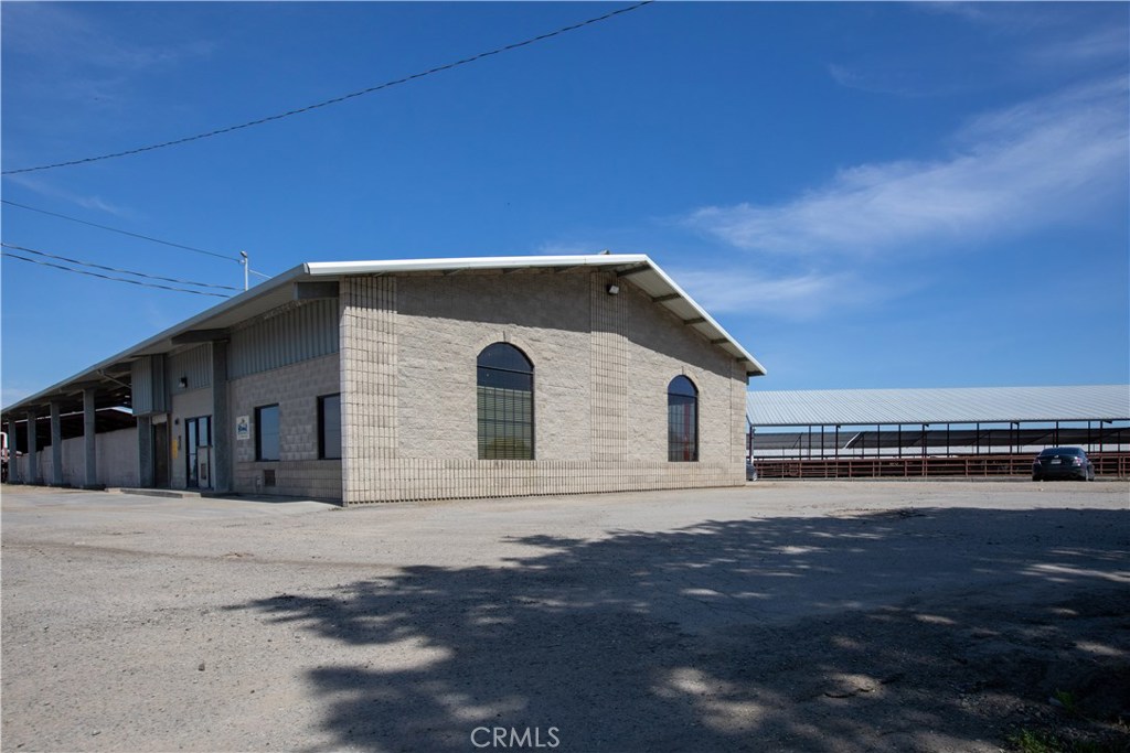 This turnkey dairy facility is situated on 317.84 acres with 4 parcels. Approximately 250 acres of farmable land. Facility is permitted for housing 1250 milk cows, 1500 mature milking and dry cows, and 1175 support stock. Flex facility designed for either Jersey or Holstein cows. Featuring 2 milk tanks with 11,000 gallons of milk capacity, large commercial shop and smaller shop, 10-bay commodity barn & forage facility with extensive pit area, soaker system, and fans for keeping stock cool. Approx. 2275 total lockups and approx. 2295 beds under barns. Maternity/calving pins. Flush lanes & lots of concrete throughout making it easy to clean and manage. 5 wells, Riparian water with the adjoining river, and pipeline irrigation & valves provide ample water supply. Leveled land. 2 custom-built homes, a duplex and 2 mobile homes.