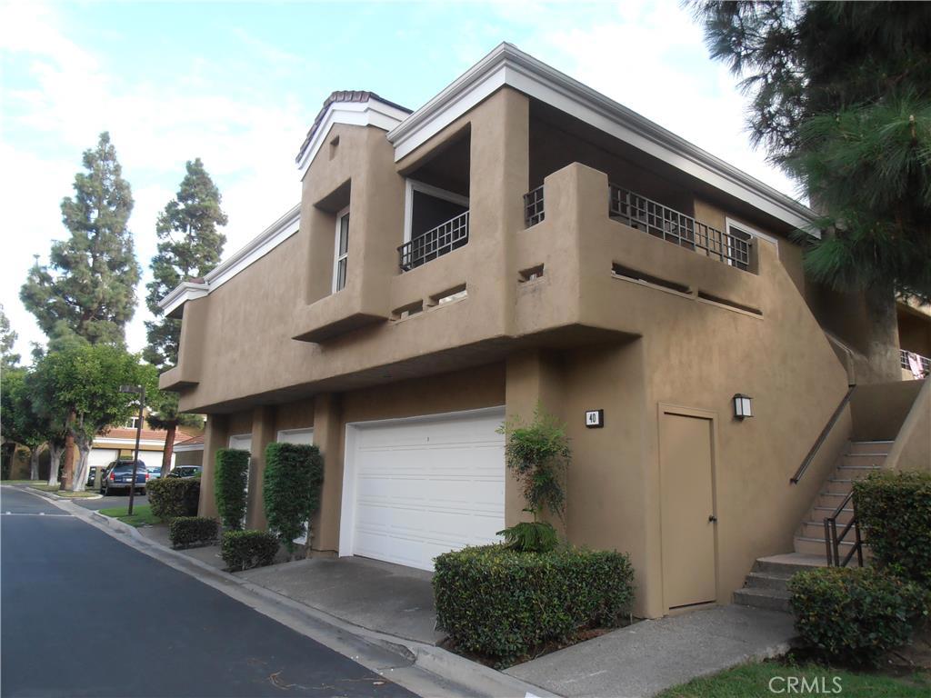 ABSOLUTELY GORGEOUS. HIGHLY UPGRADED. Spacious 2 bedrooms 2 baths 2 car garage end unit, no one above or below, in the gated community of Oxford Court. Featuring large living room with beautiful Italian ceramic tile flooring, cathedral ceilings and lots of windows. Kitchen with stainless steel appliances and gorgeous granite countertops. Master bedroom and the second bedroom with mirrored closet doors. Bathrooms are upgraded with beautiful tile flooring, granite top vanities, new sinks, faucets, mirrors & light fixtures. Large patio perfect for entertaining. Upgrades include new two tone designer paint, new high-end carpet, new base boards, all newer appliances, new ceiling fan, new light fixtures, recessed lights, newer air conditioner, washer and dryer, refrigerator and much more. Light & bright just a few minutes walking distance to UCI and Uni High, beautiful Mason regional park, bike paths, running trails, schools, shopping and dining. This is a must see!