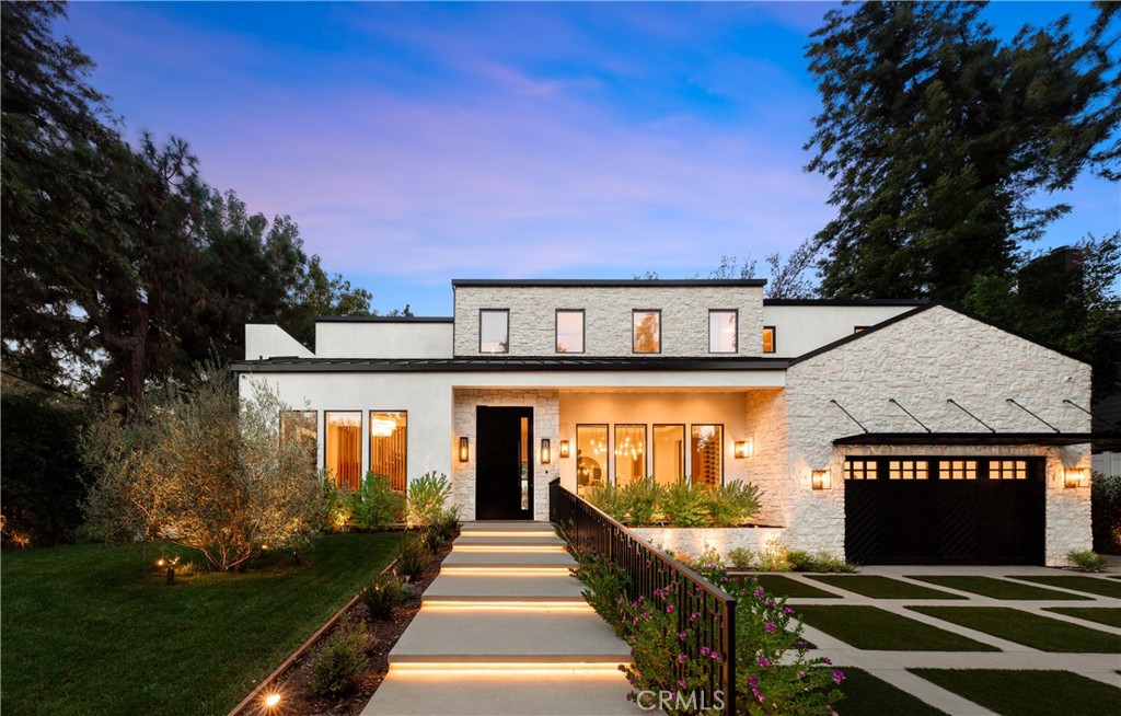 Introducing a captivating new construction estate situated South of the Boulevard in prime Encino. Enter through a grand front door into a light and airy open floor plan that boasts high ceilings and walls of glass that fill the interior with soft natural light. A culinary enthusiast's dream, the gourmet chef’s kitchen is equipped with top-of-the-line Thermador appliances, a center island with a breakfast bar and walk-in pantry. A massive sliding door that spans the length of the kitchen and family room opens up to provide the quintessential indoor/outdoor living experience. Rounding out the main level is a living room, formal dining room and ensuite bedroom. Travel up the modern floating staircase to find four ensuite bedrooms and a laundry room. The primary suite is a true retreat, featuring a private balcony overlooking the backyard, a hidden walk-in closet and an exquisite spa inspired bathroom complete with a soaking tub, oversized steam shower and double vanity. Designed with entertaining in mind, the lower level consists of a spacious lounge area with a wet bar, state-of-the-art home theater, gym and ensuite bedroom. Fully gated and meticulously landscaped, enjoy a sense of privacy and tranquility while in the backyard oasis. Take a dip in the refreshing pool/spa, entertain around the outdoor kitchen or host an al fresco dinner party on the expansive patio. Additionally, there’s a cabana with a full bathroom and large grassy yard. Further amenities include a security system and a two-car garage.
