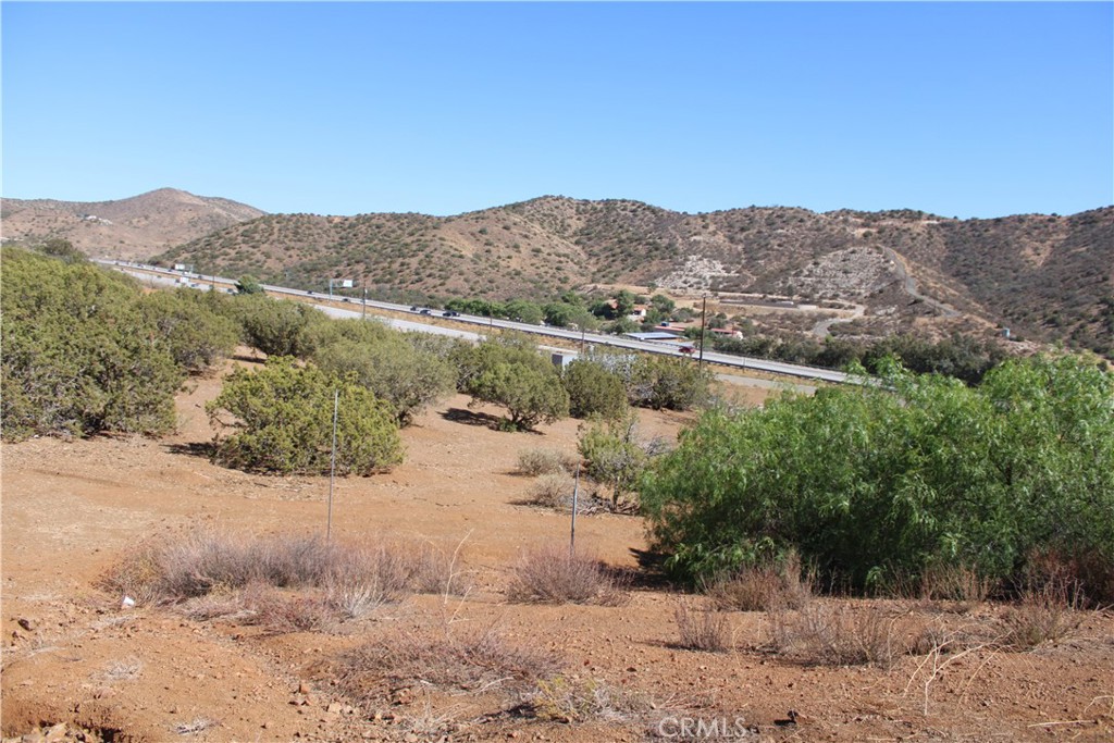 Build your own self-sustaining mini ranch on this 2 acre +/- RES/AG with LCA11 zoning. Easy access. Located almost to Escondido Summit, this beautiful sloping fenced lot offers views of the sunrise across rolling hills. It is located on a paved road. Electricity is nearby. Previously approved well permit - Future well has been marked. Lot is surrounded by numerous improved properties. The owner of land, accessed directly from Valley Sage, plans to develop 280 new homes which will bring modern infrastructure to the neighborhood. Grading is already in progress. Feels like out in the country but just minutes from Santa Clarita or Palmdale.
Broker/Agent does not guarantee the accuracy of the square footage, lot size or other information concerning the conditions or features of the property provided by the seller or obtained from Public Records or other sources. Buyer is advised to independently verify the accuracy of all information through personal inspection and with appropriate professionals to confirm material information about the property. Buyer to verify land use possibilities.