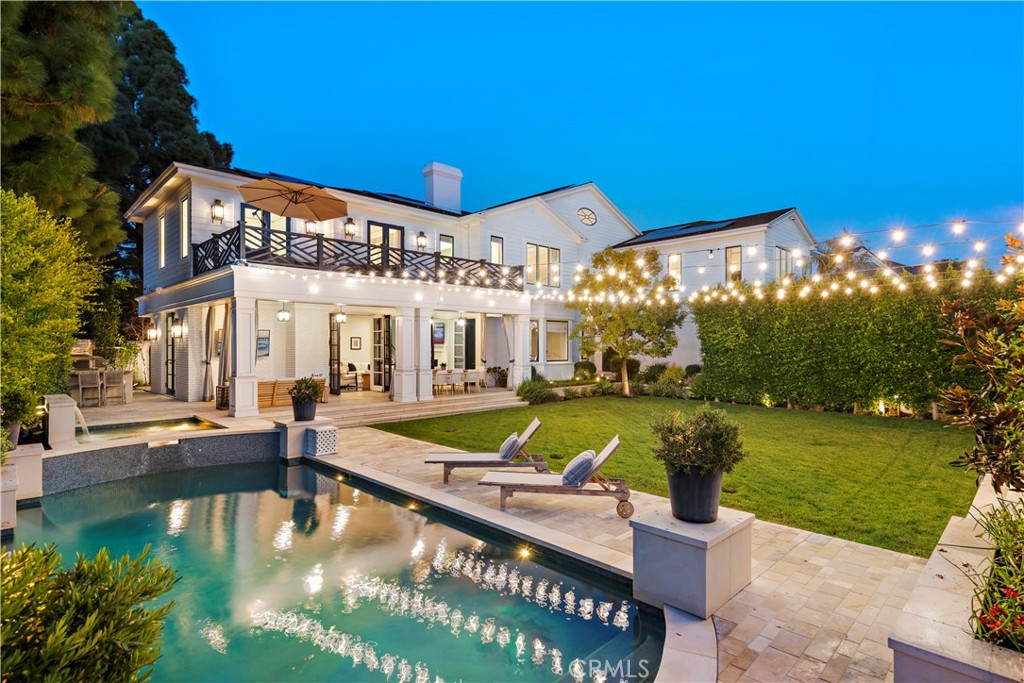 Poised within the prestigious Big Canyon community is a dream estate that is one of the most exquisite offerings in Newport Beach. This luxurious estate features an amazing floor plan that flows seamlessly into each room with an overflow of natural light. Greeting upon entry, beyond the expansive walkway is the grand foyer that perfectly transitions into the formal living room. The gourmet kitchen holds beautiful cabinetry and a vast center island. Adjacent to the kitchen is the family room which features three sets of glass double doors that lead to an entertainers paradise. The outdoor area of the estate boasts a swimming pool and spa, a seating area perfect for relaxation, an open area filled with lush greens, and a guest house, all being illuminated by beautiful string lights. On the upper level are the spectacular master suite, four generous bedrooms, and a loft. Additional highlights include a guard gated community, community golf course, laundry room, three-car garage, vast outdoor area, and many more. Conveniently located across from Fashion Island, shopping, and dining, this estate allows perfectly for the Newport Beach lifestyle. This trophy opportunity offers its buyer the finest living experience, all whilst being surrounded by the best that Newport Beach has to offer.