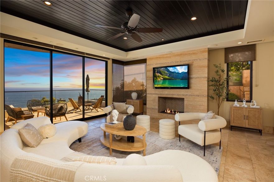 Step into this exquisite residence, strategically positioned to offer unparalleled vistas of the ocean, Catalina Island, and the sweeping coastline. This home epitomizes luxury with its bold architectural design and seamless functionality. An elevator effortlessly connects all levels, enhancing convenience and sophistication. Conveniently situated just a short 10-minute drive from the beach and adjacent to the renowned Aliso Peak Trail.



Boasting 4 bedrooms and 4.5 bathrooms, including a versatile fourth bedroom ideal for an office, gym, or den, this residence caters to every lifestyle need. A media room and a refrigerated wine room add to the allure, perfect for entertainment and relaxation.



The gourmet kitchen is a culinary masterpiece, equipped with top-of-the-line appliances including a Sub-Zero Refrigerator, Thermador 6 burner cooktop, double ovens, and Fisher Paykel dishdrawers. Walls of windows throughout the home frame breathtaking views of the white water and endless ocean, while three meticulously crafted stone-finished decks invite both relaxation and sophisticated entertaining.



Just steps from the kitchen lies a fully equipped BBQ station featuring a 42' stainless Lynx BBQ with cocktail pro and under counter refrigerator, ideal for al fresco dining against the backdrop of stunning ocean sunsets.



For ultimate relaxation, ascend to the upper tier of the property where a salt water spa awaits, offering panoramic 180-degree coastline views—a serene retreat after a day spent enjoying the nearby beach.



Every detail of this residence exudes luxury and refinement, creating a lifestyle of unparalleled coastal elegance.