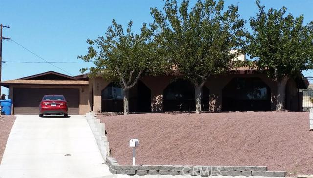 NEWER 30 YEAR COMPOSITION ROOF ON THE HOUSE, GARAGE AND PATIO'S by close of escrow! FHA, CONVENTIONAL OR VA FINANCING! Best house on the market in this price range! Mojave Manor is a good neighborhood! Easy freeway access newer Hwy 58 to I-15. 20-25 min to Apple Valley area. Be sure to check out this adorable well maintained home. It has large bedrooms approximately 14x12, large size living room and split floor plan. Breakfast bar opens into dining area. Pantry area beside fridge. Fridge is included. Just installed dual pane windows in all 4 bedrooms. The stucco was redone on this home. Front and back landscaping, a lot of concrete, patio's in back and fire pit was also done to this home in 2013 at approximate cost of $17,000. The relaxing 3 shaded covered patios are large enough for patio furniture and gatherings! Home is sold as is. Pictures don't do justice. Must see this home! Call today! Association Amenities: None # of RV Spaces: 0 Special Features: PTRYNONE Lot Location Type: Standard Location Landscaping: Sprinklers # of Attached Spaces: 0 # of Detached Spaces: 2