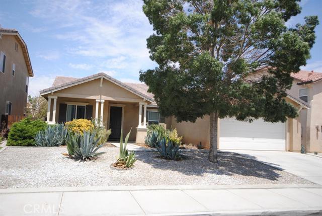 Beautiful Victorville home with NO Mello-roos tax! Located on a good looking street with sidewalks, mature tree, front professional landscaping that is low water use, tile roof, 2 car attached garage and covered front porch. Living room and family room with fireplace, open kitchen with PANTRY, LARGE ISLAND, clean white tile counters, white appliances and lots of storage...this is a great place to prepare and enjoy delicious meals. 4 bedrooms, 2 bathrooms, indoor laundry room, patio and much more! Schedule a time to view the interior and you'll be happy that you did. Association Amenities: None # of RV Spaces: 0 Special Features: BN,PTRYNONE Lot Location Type: Standard Location # of Attached Spaces: 2 # of Detached Spaces: 0