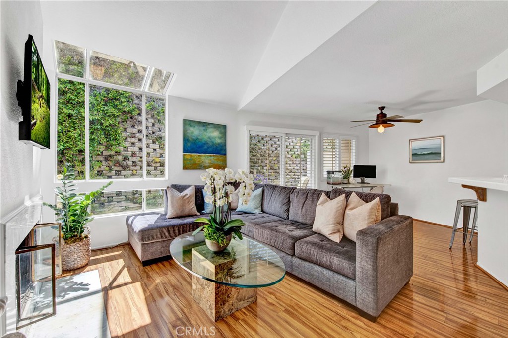 LAGUNA’s BEST KEPT SECRET! Charming Laguna Beach Cape Cod style townhome nestled in the lush, manicured Laguna Terraces community. Located just minutes to beautiful beaches, amazing hiking and biking trails with easy access to the 133 and 73 toll roads, this well appointed townhome offers vaulted ceilings and skylights bathing the welcoming floor plan in natural light. Enter the spacious living room which includes a cozy fireplace and opens to a private garden patio. The bright kitchen comes complete with a stainless steel refrigerator, dishwasher, gas range, and built-in desk. The kitchen counter has a convenient pass-through into the dining area overlooking the succulent garden. The spacious master suite with soaking tub, double vanity, and closets is light and comfortable. The secondary bedroom offers a private bath and large closet. This home has abundant storage in every room and an attached garage with a full size washer & dryer plus a detached garage across the way. Enjoy resort style living and easy access to Laguna Beach schools and all the magic Laguna has to offer! No MELLO ROOS and low tax rate! Do not miss this one!