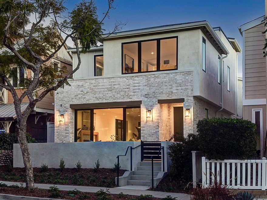 Walking distance from the beach, this 4 bed, office, 5 bath newly built property by Thomas James Homes is located in a gorgeous neighborhood within the flower streets. Entering past the covered front porch, a sense of comfort arises as a gust of sea breeze from the sliding doors of the great room fills the open floor concept with a homey feel, or simply having the gas fireplace on to warm the area. Host dinner parties in the formal dining room just steps away from the five-star kitchen. The kitchen has plenty of counter space, an island with bar seating, and top of the line kitchen appliances. Open the stacking doors to the courtyard and outdoor patio to enjoy seven hundred square foot of outdoor space. Additionally, there is a flex room, powder bath, laundry room with a sink, as well as a mud room right off the multi-car garage. Before heading upstairs by taking either the stairs or elevator, there is a private entrance to the attached accessory dwelling unit with a private porch, and upstairs there is a spacious living room, kitchen space, en suite, and closet. On the second floor of the main home, there are two secondary bedrooms with an en suite, and a roomy grand suite with a grand bath which hosts a freestanding tub, walk-in shower, dual-sink vanity, and a lovely walk-in closet. On the third floor, there is a powder room and a spacious roof deck.