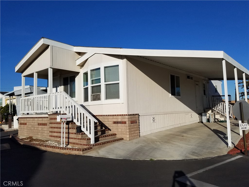 Live in the South Bay affordably! Fabulous newer 2-bedroom, 2-bath home in clean, quiet family park, Torrance Unified School Dist. top-rated schools. Beautiful, very clean home--new wood laminate flooring throughout. Bright kitchen with vaulted ceiling, skylight, all appliances included. Laundry room with washer and dryer. Corner lot with two driveways, large front porch. Gated community with club house, pool, Jacuzzi, billiards room, and more. Prime West Torrance location, close to shopping, parks, public library, civic center. Enjoy ocean breezes year-round, or drive/bicycle to the beach in minutes! Great value! Priced to Sell!
